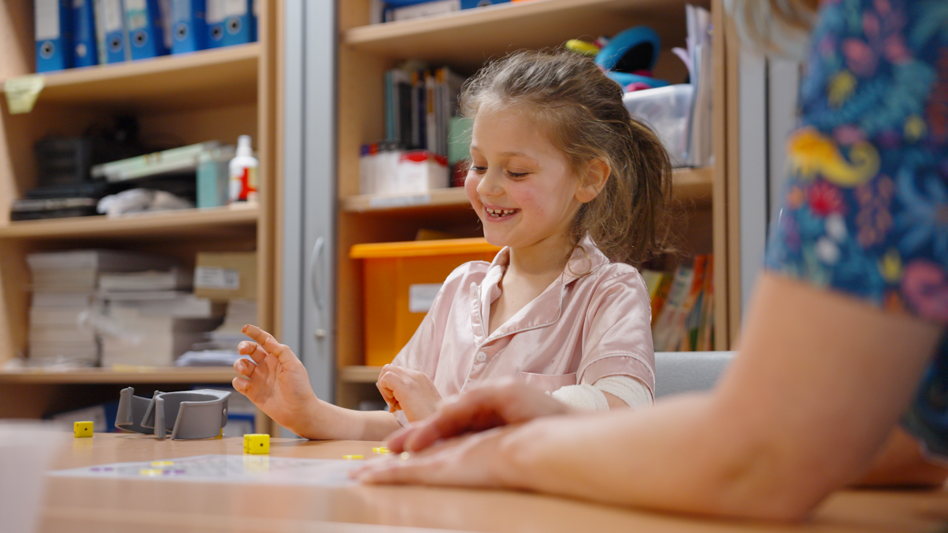 Young patient in the classroom working with play specialist