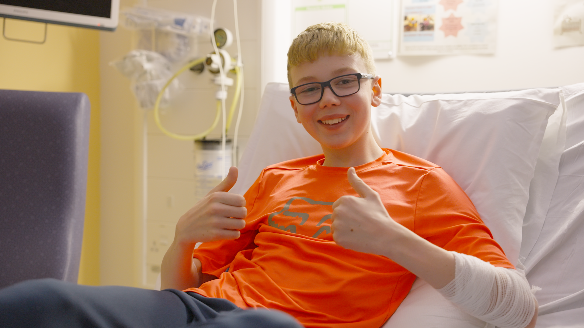 Young male patient giving a thumbs up