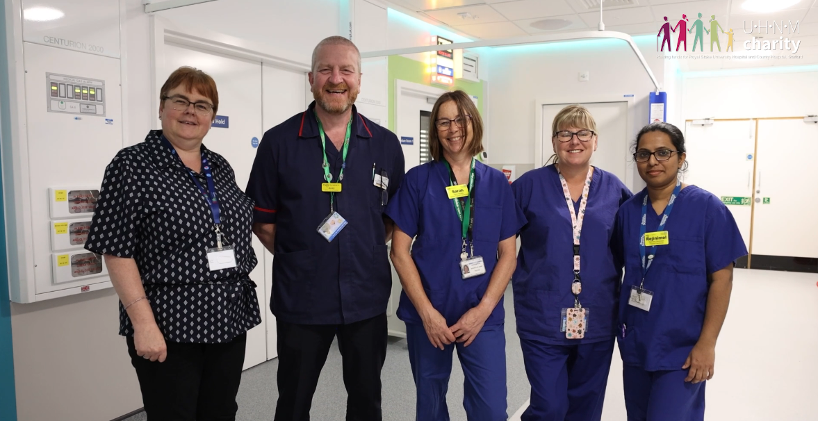 Treatment suite colleagues standing together in a row